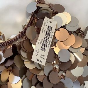 Very chic large sequins in gold and bronze attached with bronze beading.